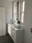 white tiles bathroom.jpeg